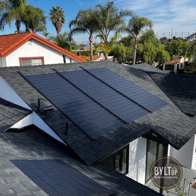 Long Beach area GAF Timberline Solar Roof Shingle Installation - Fully integrate GAF Timberline Solar roofing shingle in charcoal color completed on Roswell Ave in Long Beach, California. There is no solar racking necessary, the solar shingle is nailed directly to the roof deck... It's a roof with energy, it's that simple! Long Beach area GAF Timberline Solar Roof Shingle Installation - Fully integrate GAF Timberline Solar roofing shingle in charcoal color completed on Roswell Ave in Long Beach, California. There is no solar racking necessary, the solar shingle is nailed directly to the roof deck... It's a roof with energy, it's that simple!