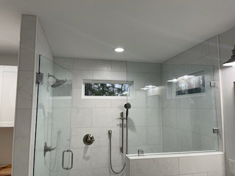 Guest bathroom remodel - The old guest bathroom had a single bowl vanity and small tub/shower. Now guest can shower with a larger shower and double vanity for more space. Great job team.