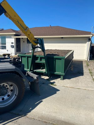 10 Cubic Yard (Clean Dirt) - For dirt disposal, we exclusively offer our 10 cubic yard dumpster, as it is the only size capable of safely accommodating the weight of heavy materials like dirt.
We provide this dumpster at a flat rate with no weight limit as all disposal fees are included. “Clean dirt” refers to concrete only, and pricing will vary if any other materials are mixed in.
The 10 cubic yard is 2.5ft H x 8ft W x 14ft L. Like all our dumpsters, it has double doors that swing open for easy access. There is no weight limit on any heavy debris containers. 10 Cubic Yard (Clean Dirt) - For dirt disposal, we exclusively offer our 10 cubic yard dumpster, as it is the only size capable of safely accommodating the weight of heavy materials like dirt.
We provide this dumpster at a flat rate with no weight limit as all disposal fees are included. “Clean dirt” refers to concrete only, and pricing will vary if any other materials are mixed in.
The 10 cubic yard is 2.5ft H x 8ft W x 14ft L. Like all our dumpsters, it has double doors that swing open for easy access. There is no weight limit on any heavy debris containers.