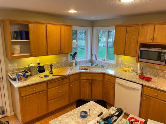 Cabinet staining - Why replace your cabinets when you can Refinish them for a lot cheaper? We fully sanded these oak cabinets, then we thoroughly cleaned them and hand applied stain. We also laid flooring throughout the house. As well as painted the interior of this house, giving it a full transformation. A more modern look was achieved, and the client was beyond happy. If you can imagine it, we can do it! Cabinet staining - Why replace your cabinets when you can Refinish them for a lot cheaper? We fully sanded these oak cabinets, then we thoroughly cleaned them and hand applied stain. We also laid flooring throughout the house. As well as painted the interior of this house, giving it a full transformation. A more modern look was achieved, and the client was beyond happy. If you can imagine it, we can do it!