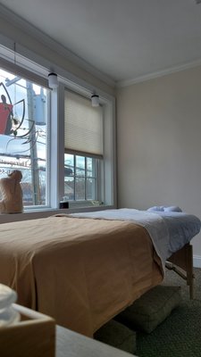 Therapeutic Relief Through Massage - This is a part of my studio. 
I offer Therapeutic massage work on this part of my clinic where I primarily help people with neck, shoulder, & mid-back pain.