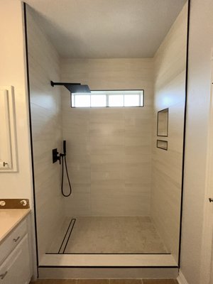 Bathtub to shower conversion - For this project, we transformed an outdated bathtub into a modern, spacious walk-in shower. The homeowners wanted a sleek, low-maintenance design with improved accessibility and style. We installed high-quality tile, a frameless glass enclosure, and updated fixtures to create a clean, contemporary look. Every detail—from waterproofing to finishing touches—was handled with precision, ensuring a durable and elegant result. Bathtub to shower conversion - For this project, we transformed an outdated bathtub into a modern, spacious walk-in shower. The homeowners wanted a sleek, low-maintenance design with improved accessibility and style. We installed high-quality tile, a frameless glass enclosure, and updated fixtures to create a clean, contemporary look. Every detail—from waterproofing to finishing touches—was handled with precision, ensuring a durable and elegant result.