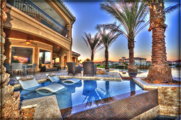 Tile cleaning - This beautiful pool was in much need of tile cleaning. After years of the sun baking the harsh chemical into the tile.