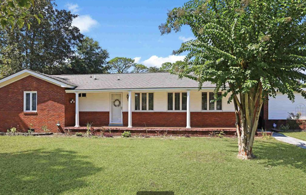 611 Calhoun Rd. Myrtle Beach, SC 29577 - Enjoy the prestigious location and peaceful living of this 3 bedroom 2 bath home, situated on an approximate 1/3 acre corner lot of Woodside Ave. & Calhoun Rd. in the Pine Lakes community. This beautiful home offers a spacious open floor plan, timeless hardwood & tile flooring, smooth flat ceilings with crown moulding, and an abundance of natural lighting. You will love the warmth offered by the fireplace on cozy nights spent indoors and the spacious front porch offering the perfect place to enjoy the afternoon breeze. This home affords you easy access to the beach and golfing along with all of the other activities and happenings in Myrtle Beach including fun eateries, award winning off-Broadway shows, public fishing piers, and intriguing shopping adventures along the Grand Strand. Conveniently located to your everyday needs, including grocery stores, banks, post offices, medical centers, doctors offices, and pharmacies. Check out our state of the art 3-D Virtual Tour. 611 Calhoun Rd. Myrtle Beach, SC 29577 - Enjoy the prestigious location and peaceful living of this 3 bedroom 2 bath home, situated on an approximate 1/3 acre corner lot of Woodside Ave. & Calhoun Rd. in the Pine Lakes community. This beautiful home offers a spacious open floor plan, timeless hardwood & tile flooring, smooth flat ceilings with crown moulding, and an abundance of natural lighting. You will love the warmth offered by the fireplace on cozy nights spent indoors and the spacious front porch offering the perfect place to enjoy the afternoon breeze. This home affords you easy access to the beach and golfing along with all of the other activities and happenings in Myrtle Beach including fun eateries, award winning off-Broadway shows, public fishing piers, and intriguing shopping adventures along the Grand Strand. Conveniently located to your everyday needs, including grocery stores, banks, post offices, medical centers, doctors offices, and pharmacies. Check out our state of the art 3-D Virtual Tour.