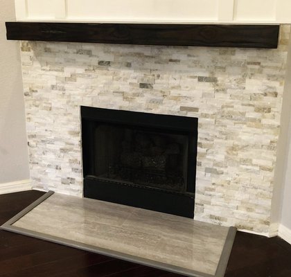 Fireplace Remodel - We retiled around the fireplace on the wall and we replaced the tile out front on the floor as well. We took wainscot and went all the way up to the ceiling with it and painted it. This was accomplished to bring more light into the space and give it a more updated look. Fireplace Remodel - We retiled around the fireplace on the wall and we replaced the tile out front on the floor as well. We took wainscot and went all the way up to the ceiling with it and painted it. This was accomplished to bring more light into the space and give it a more updated look.