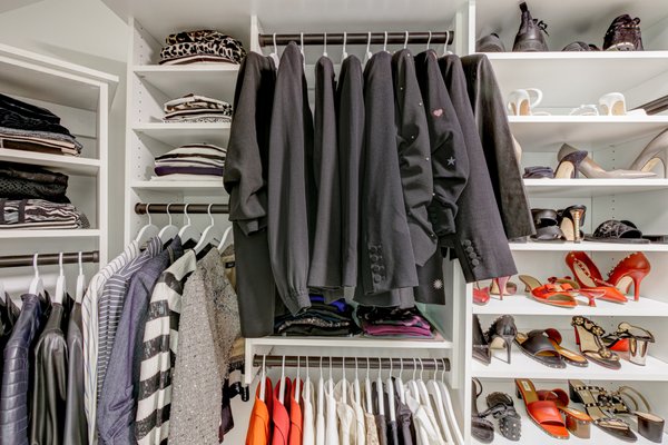 Custom White Master Closet In Metro Atlanta Home - Grace and her husband are soon nearing retirement and have been thinking a lot about how to organize their home for themselves and eventually for their children to inherit the home after they pass on. Grace was struggling with organizing her closet space especially. She and her husband had clothes everywhere! Grace's new master closet from Artisan Custom Closets has enabled her to be able to quickly identify her items, better care for her clothing, and increase her home value. Originally the closet was intended for her and her husband to store their items but Grace's husband decided to gift her the space and now she is storing only her items there. Her husband has moved his things to the guest room which Artisan Custom Closets is in the process of designing. Custom White Master Closet In Metro Atlanta Home - Grace and her husband are soon nearing retirement and have been thinking a lot about how to organize their home for themselves and eventually for their children to inherit the home after they pass on. Grace was struggling with organizing her closet space especially. She and her husband had clothes everywhere! Grace's new master closet from Artisan Custom Closets has enabled her to be able to quickly identify her items, better care for her clothing, and increase her home value. Originally the closet was intended for her and her husband to store their items but Grace's husband decided to gift her the space and now she is storing only her items there. Her husband has moved his things to the guest room which Artisan Custom Closets is in the process of designing.