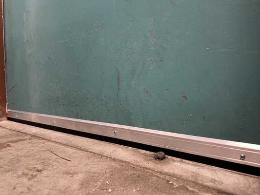 Door sweepers installed on the warehouse backdoors - Door sweepers installed on the warehouse back doors Door sweepers installed on the warehouse backdoors - Door sweepers installed on the warehouse back doors