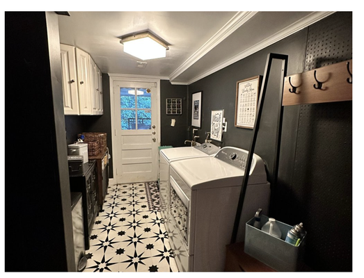 LAUNDRY ROOM REFRESH - Simply moving the giant old wardrobe out of the room from previous owners opened this room up a lot. We replaced the dated track lighting with a flush mount light that provided a more pleasant glow that lit the whole room instead of straight down, Painted the walls a deep gray, and used vinyl floor tiles for an easy update of this basement laundry.