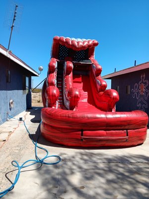 16 ft Red Waterslide - Everyone loves this waterslide! A little taller than the green one and the wave up top adds shade while sitting at the top of the slide.
