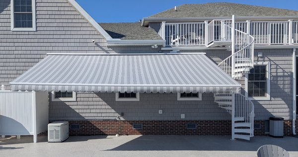 23' Awning Installation - This 23' awning with a 14' projection we installed for a client to provide some much needed shade on those still hot days. The client opted for LED lights giving the awning extended use and value for night time ambiance. We installed the TV as well for outdoor entertainment. 23' Awning Installation - This 23' awning with a 14' projection we installed for a client to provide some much needed shade on those still hot days. The client opted for LED lights giving the awning extended use and value for night time ambiance. We installed the TV as well for outdoor entertainment.
