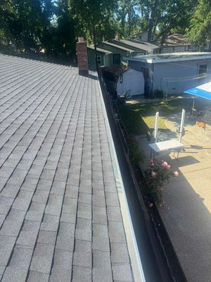 GAF Charcoal Rs Shingle with gutters guards installed in gutters - Beautiful upgrade with GAF HDZ RS Charcoal shingles and new gutter guards. The charcoal color gives a sharp modern look, and the gutters are now better protected from debris.