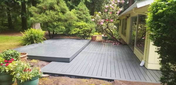 In-ground Deck Rebuild | Bellevue, WA - This in-ground deck was over 30 years old when I went to meet with the customer. The decking was rotter throughout, and despite the structural frame being in decent shape we decided to replace it to avoid future issues. We used "ground contact pressure treated lumber and Trex Composite decking" to make sure that this new beautiful deck lasts twice as long this time. In-ground Deck Rebuild | Bellevue, WA - This in-ground deck was over 30 years old when I went to meet with the customer. The decking was rotter throughout, and despite the structural frame being in decent shape we decided to replace it to avoid future issues. We used "ground contact pressure treated lumber and Trex Composite decking" to make sure that this new beautiful deck lasts twice as long this time.