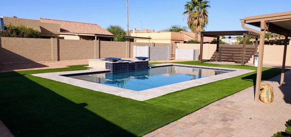Backyard Turf install - Installed premium turf around this beautiful rectangular pool, completing the outdoor space with a clean, low-maintenance lawn. Perfectly complements the pool’s design, offering a lush green area for relaxation and fun.