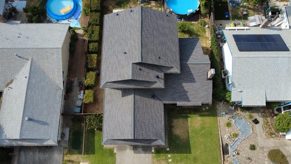 Roof Replacement - Shingle Roof - Project Description: GAF HDZ® Architectural Shingle Roof – Charcoal
Ark Roofing and Construction recently completed a full residential roof replacement using GAF Timberline HDZ® architectural shingles in the popular Charcoal color. This project was designed to improve the home’s durability, energy efficiency, and overall curb appeal while providing long-term protection against the elements.
The existing roof showed signs of age and wear, including granule loss and weather-related damage. Our team performed a full tear-off to the decking, completed a detailed roof inspection, and installed a complete GAF roofing system to ensure optimal performance and manufacturer compliance.
We installed GAF Timberline HDZ® shingles, known for their LayerLock® Technology, enhanced wind resistance, and dimensional architectural appearance. The Charcoal color delivers a clean, modern look that pairs well with a wide range of exterior styles while helping maintain strong resale value.
Scope of Work Included:
Full roof tear-off and debris removal
Decking inspection and necessary repairs
Synthetic underlayment installation
GAF starter strips and ridge cap shingles
GAF Timberline HDZ® architectural shingles (Charcoal)
Precision flashing installation around penetrations
Final cleanup and quality inspection
This roof replacement provides improved wind resistance, leak protection, and long-term reliability, backed by GAF manufacturer warranties. Our experienced roofing crew followed industry best practices and local building codes to deliver a high-quality, professional installation.
If you’re looking for a trusted roofing contractor, GAF-certified roof installation, or architectural shingle roof replacement, Ark Roofing and Construction delivers results you can rely on.
📍 Serving homeowners with professional residential roofing solutions
🏠 Asphalt shingle roof replacement specialists
⭐ Quality workmanship • Clear communication • Reliable timelines