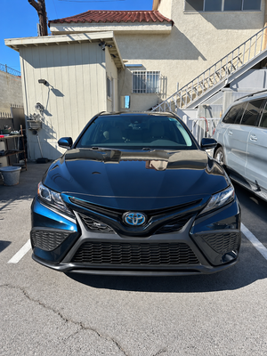 Toyota Camry | Front End Collision Repair - This Toyota Camry arrived at our shop with significant front-end collision damage, including a bent hood, damaged front bumper, and misaligned grille. Our team restored the damaged front-end components and refinished the repaired areas to bring back the vehicle's clean, factory-style appearance. The before and after photos highlight the transformation. Toyota Camry | Front End Collision Repair - This Toyota Camry arrived at our shop with significant front-end collision damage, including a bent hood, damaged front bumper, and misaligned grille. Our team restored the damaged front-end components and refinished the repaired areas to bring back the vehicle's clean, factory-style appearance. The before and after photos highlight the transformation.