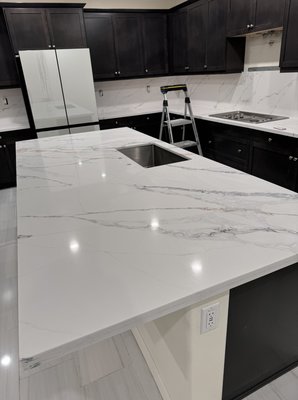 Countertop Replacement Only - Replacing a countertop involves removing the old surface and installing a new one, tailored to fit your kitchen. This process enhances the kitchen's aesthetic and functionality, with popular material choices including granite, quartz, and marble. Accurate measurement, careful removal, and professional installation ensure a seamless, durable finish that can significantly refresh the space.