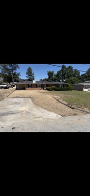 Concrete driveway - Fresh grade, deck set up and concrete pour of a drive way and pad.