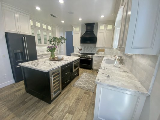 Wholesale Prices To The Public - This remodel was done to an old kitchen. The remaining of the house was updated and the kitchen stood out like a sore thumb so we did custom cabinets with quartzite slabs fabrication and custom backsplash. Wholesale Prices To The Public - This remodel was done to an old kitchen. The remaining of the house was updated and the kitchen stood out like a sore thumb so we did custom cabinets with quartzite slabs fabrication and custom backsplash.