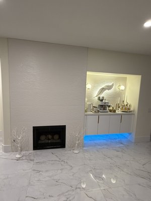 3D Sculptural Feature & Coffee Bar - A complete modern interior transformation featuring a custom coffee bar, custom 3D sculptural wall panels, integrated LED lighting, and high-end marble tile.