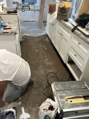 Two bedroom apartment in West Hollywood - I remove linoleum in the kitchen also brick tile in the bathroom and remove all the base molding and I install 800 sq ft water resistant laminate and 257 LN FT base molding