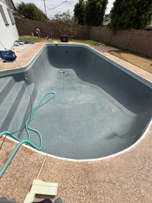 Green Pool Drain & Refill - When this pool came to us, it wasn't cloudy — it was green.
The kind of green where you can't see past the first step, where the water has stopped being water and started being an ecosystem.
This is one of our most common rescue jobs across Peoria and the West Valley, and by the time a pool gets this far gone, the algae has taken over completely: chlorine gets eaten the moment it hits the water, the stabilizer (cyanuric acid) is sky-high from months of neglect, and phosphates are feeding the bloom faster than any chemical can knock it back.
Here's the part most homeowners don't realize: you can't always "shock" your way out of a pool like this. Dumping liquid chlorine into water this far gone is like bailing out a boat with a hole in it — you'll burn through hundreds of dollars in chemicals, run your equipment ragged, and often still end up with stained plaster and cloudy water. When the chemistry is this unbalanced, draining and starting fresh is faster, cleaner, and almost always cheaper in the long run.
So that's exactly what we did.
The job, step by step:
Full drain. We safely drained the pool down completely, managing the discharge responsibly and monitoring the structure throughout — an empty pool isn't something you walk away from.
Light chlorine wash. With the pool empty, we treated the interior surfaces with a light chlorine wash to kill the embedded algae and lift the green and brown staining the bloom left behind. We use a chlorine wash rather than a full acid wash whenever we can — it's far gentler on your plaster or pebble finish and doesn't strip away surface material the way acid does. Your pool's interior is expensive; we protect it.
Detail and rinse. We scrubbed the steps, corners, and waterline, cleared out the debris the algae had been hiding, and rinsed everything so the refill started on a genuinely clean surface.
Fresh refill. We refilled with clean water and got circulation running.
Full chemical balance. Fresh water isn't balanced water. We dialed in pH, total alkalinity, calcium hardness, chlorine, and stabilizer so the pool started its new life in the right range — not just clear, but actually healthy and swim-ready.
The result: a pool that went from an unswimmable green swamp to crystal-clear, balanced water the family can actually use — with a finish that's protected for the long haul.
If your pool has gone green and you're wondering whether it's worth saving, it almost always is. The right approach just depends on how far gone the water is, your stabilizer levels, and the condition of your equipment. We'll tell you straight: sometimes a heavy treatment clears it, and sometimes a drain and refill is the smarter money. Either way, you'll know exactly what we're doing and why — and you'll get a photo report documenting the work.
If your pool needs rescuing, request a free quote and we'll get it swim-ready. Green Pool Drain & Refill - When this pool came to us, it wasn't cloudy — it was green.
The kind of green where you can't see past the first step, where the water has stopped being water and started being an ecosystem.
This is one of our most common rescue jobs across Peoria and the West Valley, and by the time a pool gets this far gone, the algae has taken over completely: chlorine gets eaten the moment it hits the water, the stabilizer (cyanuric acid) is sky-high from months of neglect, and phosphates are feeding the bloom faster than any chemical can knock it back.
Here's the part most homeowners don't realize: you can't always "shock" your way out of a pool like this. Dumping liquid chlorine into water this far gone is like bailing out a boat with a hole in it — you'll burn through hundreds of dollars in chemicals, run your equipment ragged, and often still end up with stained plaster and cloudy water. When the chemistry is this unbalanced, draining and starting fresh is faster, cleaner, and almost always cheaper in the long run.
So that's exactly what we did.
The job, step by step:
Full drain. We safely drained the pool down completely, managing the discharge responsibly and monitoring the structure throughout — an empty pool isn't something you walk away from.
Light chlorine wash. With the pool empty, we treated the interior surfaces with a light chlorine wash to kill the embedded algae and lift the green and brown staining the bloom left behind. We use a chlorine wash rather than a full acid wash whenever we can — it's far gentler on your plaster or pebble finish and doesn't strip away surface material the way acid does. Your pool's interior is expensive; we protect it.
Detail and rinse. We scrubbed the steps, corners, and waterline, cleared out the debris the algae had been hiding, and rinsed everything so the refill started on a genuinely clean surface.
Fresh refill. We refilled with clean water and got circulation running.
Full chemical balance. Fresh water isn't balanced water. We dialed in pH, total alkalinity, calcium hardness, chlorine, and stabilizer so the pool started its new life in the right range — not just clear, but actually healthy and swim-ready.
The result: a pool that went from an unswimmable green swamp to crystal-clear, balanced water the family can actually use — with a finish that's protected for the long haul.
If your pool has gone green and you're wondering whether it's worth saving, it almost always is. The right approach just depends on how far gone the water is, your stabilizer levels, and the condition of your equipment. We'll tell you straight: sometimes a heavy treatment clears it, and sometimes a drain and refill is the smarter money. Either way, you'll know exactly what we're doing and why — and you'll get a photo report documenting the work.
If your pool needs rescuing, request a free quote and we'll get it swim-ready.