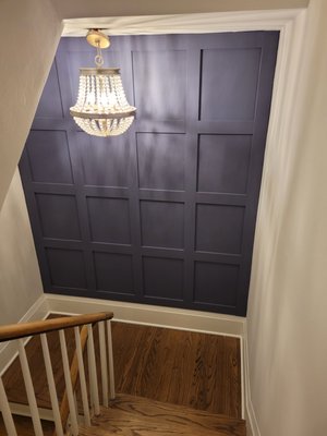 Custom Wainscoting/Panel Wall - We added interest to a wall by measuring the space, planning a wainscoting/panel layout, cutting pieces, installing, and painting. The installation was a one-day project. Our client painted the wall afterwards. Custom Wainscoting/Panel Wall - We added interest to a wall by measuring the space, planning a wainscoting/panel layout, cutting pieces, installing, and painting. The installation was a one-day project. Our client painted the wall afterwards.