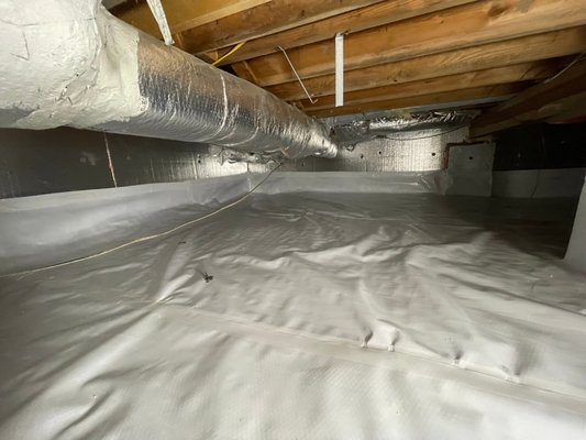 Crawl Space Insulation - crawl space encapsulation with spray foam, panel insulation and vapor barrier.