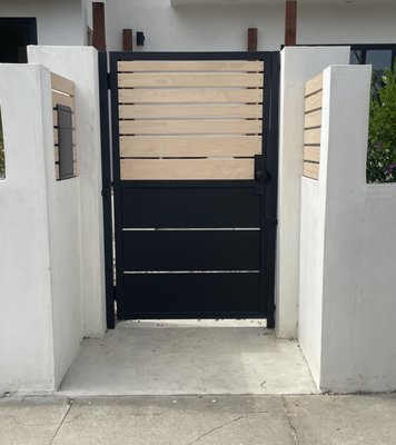 Venice Beach Custom Gates and Infill - A comprehensive perimeter security solution featuring custom-fabricated steel pedestrian gates and sealed white pine architectural infill panels. This project focused on blending modern coastal aesthetics with heavy-duty structural integrity. Every component was precision-engineered in our facility and professionally installed to ensure long-term durability and seamless operation in a coastal environment. Venice Beach Custom Gates and Infill - A comprehensive perimeter security solution featuring custom-fabricated steel pedestrian gates and sealed white pine architectural infill panels. This project focused on blending modern coastal aesthetics with heavy-duty structural integrity. Every component was precision-engineered in our facility and professionally installed to ensure long-term durability and seamless operation in a coastal environment.