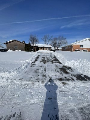 residential driveway snow removal - this is a residential client that had 12 inches of snow on their driveway and couldn’t even pull in the driveway. We got it cleaned up nicely for them so they could use it and access it even with all that snow on the ground.