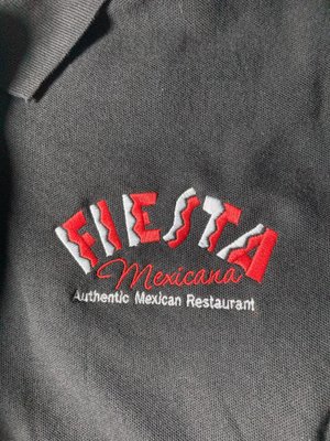 Fiesta Mexicana Louisburg Embroidered shirts - At InkTerra Prints, we had the opportunity to work with Fiesta Mexicana Louisburg to create embroidered polo shirts for their employees.
The client initially wanted something different from their usual stitch out. I suggested a simpler color scheme on a black polo to make the design stand out more. The results speak for themselves! The sleek and professional look of the simplified logo not only enhances brand visibility but also aligns perfectly with the black fabric, creating a striking visual impact. We're thrilled with how these shirts turned out and proud to showcase our craftsmanship and attention to detail.
If you're a fan of Fiesta Mexicana of Louisburg, you may have even noticed the color pop in their new wardrobe! Fiesta Mexicana Louisburg Embroidered shirts - At InkTerra Prints, we had the opportunity to work with Fiesta Mexicana Louisburg to create embroidered polo shirts for their employees.
The client initially wanted something different from their usual stitch out. I suggested a simpler color scheme on a black polo to make the design stand out more. The results speak for themselves! The sleek and professional look of the simplified logo not only enhances brand visibility but also aligns perfectly with the black fabric, creating a striking visual impact. We're thrilled with how these shirts turned out and proud to showcase our craftsmanship and attention to detail.
If you're a fan of Fiesta Mexicana of Louisburg, you may have even noticed the color pop in their new wardrobe!