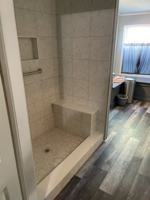 Bathroom Remodel 2024 - This remodel was done on a bathroom that needed updating.Shower floor and walls are 100% waterproof. 
We added quartz material for the top of the bench and on the shower curb. Homeowners are exited for sure!