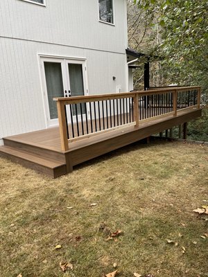 Extension of current deck - A customer approached me with a request to build a new deck in front of a French door to connect to an existing deck. This project was unique because the ground was not level, requiring us to design support for the new deck. The customer was extremely pleased with the result. Extension of current deck - A customer approached me with a request to build a new deck in front of a French door to connect to an existing deck. This project was unique because the ground was not level, requiring us to design support for the new deck. The customer was extremely pleased with the result.