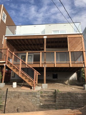 Deck Installation and Interior Remodeling Project - This home had an exterior and interior upgrade. We replaced all the windows, made roof repairs, added the deck and staircase and new flooring as well. Please to say we had a very happy client!