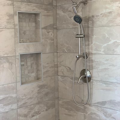 Shower Remodel - This shower was designed by the client for their master bathroom. We worked together to come up with a design that both suited their budget, and desire for two shower heads. Shower Remodel - This shower was designed by the client for their master bathroom. We worked together to come up with a design that both suited their budget, and desire for two shower heads.