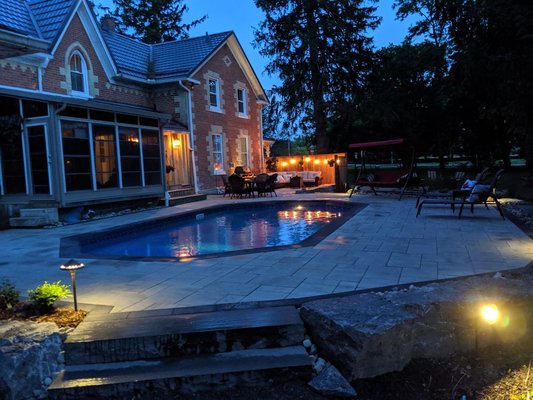 New Landscape Design and Build - This 100+ year old home got a New design and Landscape Installation. 140 Linear feet of Armour stone, natural stone steps and a paver pool deck/entertaining area. New Landscape Design and Build - This 100+ year old home got a New design and Landscape Installation. 140 Linear feet of Armour stone, natural stone steps and a paver pool deck/entertaining area.