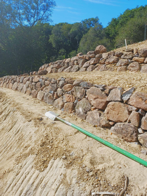 Rock walls - Rock walls or retaining walls are used to hold back soil or rock and avoid erosion while also creating a support for slopped terrain. Rock walls are generally durable and versatile in many different setting and materials such as granite, limestone, or sandstone. ¡Ask for a quote today! Rock walls - Rock walls or retaining walls are used to hold back soil or rock and avoid erosion while also creating a support for slopped terrain. Rock walls are generally durable and versatile in many different setting and materials such as granite, limestone, or sandstone. ¡Ask for a quote today!