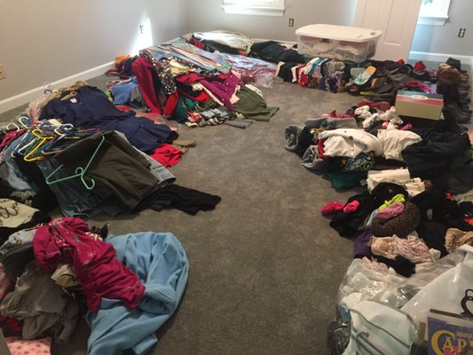 Closet Cleanout the KonMari way! - The first category in Marie Kondo's KonMari Method is clothes!  This closet cleanup was completed after a master bedroom and bathroom renovation.  The empty room gave us plenty of space to sort clothes into piles by type, then discard what no longer "sparked joy".