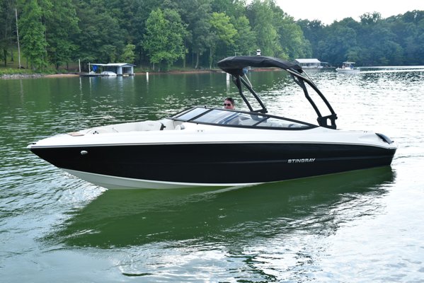 Ultimate Luxury Boat Rental On Lake Lanier. Like New 300 HP STINGRAY 23 FT!!! - Stingray 225S -300 HP...Mon-Friday $595, Weekend $695 (8 Hours). Holidays and Holiday weeks/weekends are more. MULTI DAY RENTALS AVAILABLE. TEXT FOR CUSTOMIZED PRICING!

Discover Pure Excitement on Lake Lanier with Our 23 Foot Stingray 225 SE
Unleash your inner adventurer with our Stingray 225 SE boat rental, the ultimate blend of power, luxury, and style on Lake Lanier. Powered by a robust 300 HP engine, this sleek vessel offers thrilling speeds approaching 60 mph, perfect for those craving an exhilarating ride on the water.
Features Designed for Maximum Enjoyment:
- Ski Tower: Ideal for water sports enthusiasts, the integrated ski tower provides stability and versatility for activities like water skiing and tubing.
- Tinted Windows: Enjoy enhanced privacy and reduced glare with stylish tinted windows, ensuring a more comfortable experience under the sun
- Fusion Bluetooth Sound System: Set the mood with your favorite tunes using the high-fidelity Fusion Bluetooth sound system, ensuring top-notch audio quality throughout your journey.
- Custom Blue Lighting: Enhance your evening adventures with custom blue lighting that illuminates the boat's interior and under the water, creating a captivating atmosphere.
- Electronic Trim Tabs: Enjoy smooth handling and stability with electronic trim tabs, allowing you to adjust the boat's performance based on water conditions.
- Teak Flooring: Step onto luxurious teak flooring that not only enhances the boat's aesthetic appeal but also provides comfort and durability.
- Spacious Seating: Accommodate up to 10 passengers in plush seating, though 6-7 guests will find more ample space to relax and enjoy the ride comfortably. 
Whether you're planning a day of water sports, a sunset cruise, or a leisurely exploration of Lake Lanier's scenic beauty, our Stingray 225 SE promises an unforgettable experience. Reserve your rental today and embark on a journey of luxury, speed, and adventure on the water. 

Available for daily or multiple day rentals.
We provide the option of having the boat delivered and picked up from your Vacation Renal house or preferred location for a fee, making your experience as convenient and hassle free as possible.
All rentals upon request come with a 3 Person Tube and water Ski's at no additional charge
BOAT RULES AND DISCLAIMER
- Minimum Age and Experience Requirement: All boat operators must be at least 25 years old and possess extensive boating experience. No exceptions will be made. If you are not qualified to operate the boat safely or do not meet the age requirement, you will not be permitted to drive, and no refund will be issued.
- Boating Safety Video Requirement: The designated captain must watch the Georgia Boating Safety video and adhere to all lake laws and regulations. A brief test may be administered.
- Top-Down Rule: Please refrain from putting the top down on the boat.
- Fuel Policy: Fuel is NOT included in the rental price. You will be charged $35 per ENGINE RUNNING HOUR. That means you are only being charged while the engine is running. Overnight rentals just require the tank to be refilled upon return.
- Sobriety of Captain: The boat's captain must remain sober and alert at all times while operating the vessel.
- Responsibility Acknowledgement: The captain is fully responsible for the safety of all passengers and the condition of the boat.
- Glass Prohibition: For safety reasons, no glass containers are permitted on or near the boat.
- Smoking and Open Flames: Smoking and open flames are strictly prohibited onboard.
- Dock Usage: Use designated docks only; do not take the boat ashore.
- Cleanliness Requirement: The boat will be clean upon rental. Please ensure it is returned in the same condition. A $100 cleaning fee will apply for excessive sand or difficult-to-clean substances.
- Weather Policy: No refunds will be issued due to weather conditions. Cancellations made 48 hours in advance are free of charge; please use your discretion.
- Damage Liability: Any damage to the boat or its equipment will be deducted from the deposit.
- Life Vests: Adult life vests are provided; specialty sizes (e.g., child vests) must be provided by the renter.
- Prohibited Activities: Fishing and the use of sharp objects that could damage the interior are strictly prohibited.
- Pet Policy: Pets of any kind are NOT permitted onboard.
- Punctuality: Please arrive on time before and after your trip. A $50 fee will be charged for delays exceeding 30 minutes out of courtesy for our schedule.
- Additional Services: A captain may be available for an extra fee if desired.
These rules are in place to ensure a safe and enjoyable experience for all guests. Please adhere to them during your rental period.