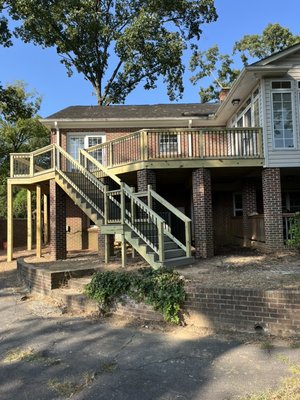 Deck Remodel - Botany Woods - We removed an existing back deck and rebuilt it around the existing brick columns. We used Deckorators Venture decking and pressure treated hand railing with aluminum balusters. Yet again, our customers were extremely pleased with the work we did. Deck Remodel - Botany Woods - We removed an existing back deck and rebuilt it around the existing brick columns. We used Deckorators Venture decking and pressure treated hand railing with aluminum balusters. Yet again, our customers were extremely pleased with the work we did.