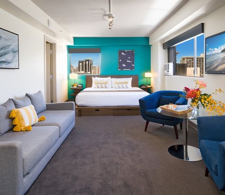 Lifestyle Junior Suite - Vacation in style in a spacious junior suite that offers a plush King bed with soft cotton linens and cozy duvet. Relax in a seating area with a table and overstuffed lounge chairs, perfect for relaxing with a cool drink after a fun day of island adventures. A desk and high speed Wi-Fi keep you connected. The larger bathroom makes it easy to rejuvenate with an oversized walk-in shower with relaxing rainfall shower head. Lifestyle Junior Suite - Vacation in style in a spacious junior suite that offers a plush King bed with soft cotton linens and cozy duvet. Relax in a seating area with a table and overstuffed lounge chairs, perfect for relaxing with a cool drink after a fun day of island adventures. A desk and high speed Wi-Fi keep you connected. The larger bathroom makes it easy to rejuvenate with an oversized walk-in shower with relaxing rainfall shower head.