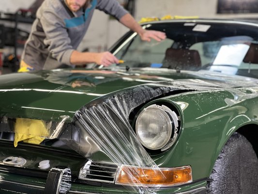 1983 Irish Green Porsche 911T Full vehicle paint protection film - This one owner, 1983 Irish Green Porsche 911T has been completely restored and stopped by our shop for a full paint correction and SunTek Ultra self healing paint protection film on the entire vehicle.