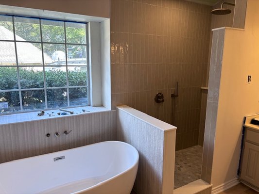 Before and after- Glassless Shower, - This bathroom was a classic example of 1980s construction, featuring a cramped, enclosed shower and an outdated whirlpool tub with artificial marble. We transformed the original 3x3, moisture-prone shower into a sleek, open-concept 3x5 glassless shower, complete with a luxurious rain head, a wall-mounted wand for versatility, and a spacious 3-foot shelf for added convenience. The result is a modern, airy space designed for comfort and style. Before and after- Glassless Shower, - This bathroom was a classic example of 1980s construction, featuring a cramped, enclosed shower and an outdated whirlpool tub with artificial marble. We transformed the original 3x3, moisture-prone shower into a sleek, open-concept 3x5 glassless shower, complete with a luxurious rain head, a wall-mounted wand for versatility, and a spacious 3-foot shelf for added convenience. The result is a modern, airy space designed for comfort and style.