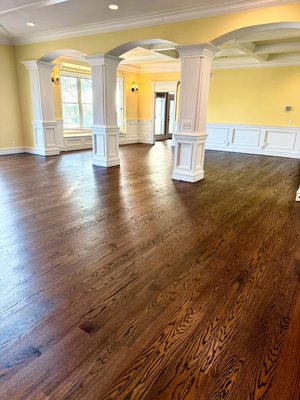 Hardwood Flooring - This project involved tearing out the existing engineered flooring and installing new flooring to be sanded and finished. Color was selected directly on floor and is a custom color. We use top of the line products, so these floors were built to last! Hardwood Flooring - This project involved tearing out the existing engineered flooring and installing new flooring to be sanded and finished. Color was selected directly on floor and is a custom color. We use top of the line products, so these floors were built to last!