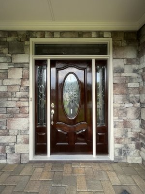 Gel stain fiberglass door inside, light with hard, red polyurethane, triple coat, and Rottenwood replacement on upper brick molding ￼ - Gel stain, fiberglass door and side, light, and three coats of hybrid polyurethane for that gleaming finish
Rotten brick molding at the top of the door was replaced, including insulation with PVC brick, mold, prepped and painted entire casing ￼