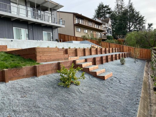 Complete backyard remodel in San Jose - A complete and detailed backyard remodel. Adding retaining walls, drainage, planting, irrigation, and artificial grass. This overhaul is only the first phase of 2 phases.
