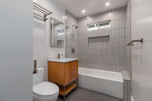 Bathroom Remodeling - In the bustling city of Los Angeles, a bathroom remodel unfolds into a serene oasis of luxury and tranquility. This transformative project marries contemporary design with classic elements, creating a space that exudes elegance and comfort.
Stepping into the bathroom, you are greeted by the soft glow of natural light streaming through an elegantly frosted window, illuminating the pristine marble floors that extend across the space. The walls, adorned with large, polished tiles in a subtle shade of dove gray, provide a sophisticated backdrop, while the delicate veining adds a touch of timeless beauty.
At the heart of this serene retreat is a freestanding bathtub, its sleek, modern silhouette inviting relaxation. Positioned beneath a cascading chandelier that sparkles like a constellation of stars, the bathtub becomes a centerpiece of luxury and calm. Nearby, a frameless glass shower enclosure boasts both a rain showerhead and hand-held wand, promising a spa-like experience with every use.
The custom vanity, crafted from rich, dark wood and topped with a lustrous quartz countertop, offers ample storage with its seamless blend of drawers and cabinets. Above, a large, backlit mirror provides perfect illumination for daily rituals, while gold fixtures and accents add a touch of warmth and sophistication.
A delicate mosaic of tiles forms an intricate border around the vanity area, adding a unique artistic flair to the room. Soft, plush towels hang from heated towel racks, ensuring comfort and indulgence with every use.
To complete the ambiance, the bathroom is equipped with smart technology, including a programmable thermostat for the underfloor heating and a built-in sound system that allows you to enjoy your favorite music or podcasts while you unwind.
Every detail, from the elegantly curved faucet to the carefully chosen lighting fixtures, reflects a meticulous attention to craftsmanship and design. This Los Angeles bathroom remodel is a sanctuary of modern elegance, offering a perfect blend of style, functionality, and comfort for a truly luxurious experience. Bathroom Remodeling - In the bustling city of Los Angeles, a bathroom remodel unfolds into a serene oasis of luxury and tranquility. This transformative project marries contemporary design with classic elements, creating a space that exudes elegance and comfort.
Stepping into the bathroom, you are greeted by the soft glow of natural light streaming through an elegantly frosted window, illuminating the pristine marble floors that extend across the space. The walls, adorned with large, polished tiles in a subtle shade of dove gray, provide a sophisticated backdrop, while the delicate veining adds a touch of timeless beauty.
At the heart of this serene retreat is a freestanding bathtub, its sleek, modern silhouette inviting relaxation. Positioned beneath a cascading chandelier that sparkles like a constellation of stars, the bathtub becomes a centerpiece of luxury and calm. Nearby, a frameless glass shower enclosure boasts both a rain showerhead and hand-held wand, promising a spa-like experience with every use.
The custom vanity, crafted from rich, dark wood and topped with a lustrous quartz countertop, offers ample storage with its seamless blend of drawers and cabinets. Above, a large, backlit mirror provides perfect illumination for daily rituals, while gold fixtures and accents add a touch of warmth and sophistication.
A delicate mosaic of tiles forms an intricate border around the vanity area, adding a unique artistic flair to the room. Soft, plush towels hang from heated towel racks, ensuring comfort and indulgence with every use.
To complete the ambiance, the bathroom is equipped with smart technology, including a programmable thermostat for the underfloor heating and a built-in sound system that allows you to enjoy your favorite music or podcasts while you unwind.
Every detail, from the elegantly curved faucet to the carefully chosen lighting fixtures, reflects a meticulous attention to craftsmanship and design. This Los Angeles bathroom remodel is a sanctuary of modern elegance, offering a perfect blend of style, functionality, and comfort for a truly luxurious experience.