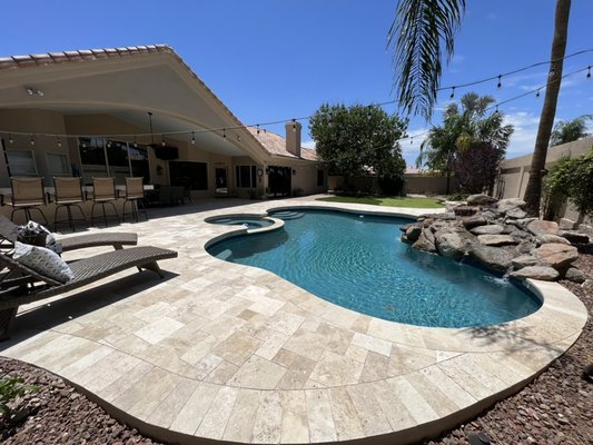 Pool deck travertine overlay, new pebble sheen interior and water feature update. - This remodel was done because the old cool deck was dilapidated. The water feature was small and out of scale. Pool deck travertine overlay, new pebble sheen interior and water feature update. - This remodel was done because the old cool deck was dilapidated. The water feature was small and out of scale.