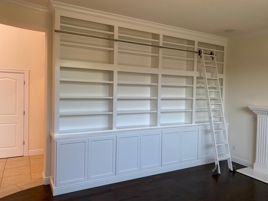 Custom Cabinetry Library - Customer was looking to add Cabinetry to two rooms in her home. We created a nice Book Shelve for her with a Rolling Ladder. We also created an Entertainment Center for her. Custom Cabinetry Library - Customer was looking to add Cabinetry to two rooms in her home. We created a nice Book Shelve for her with a Rolling Ladder. We also created an Entertainment Center for her.