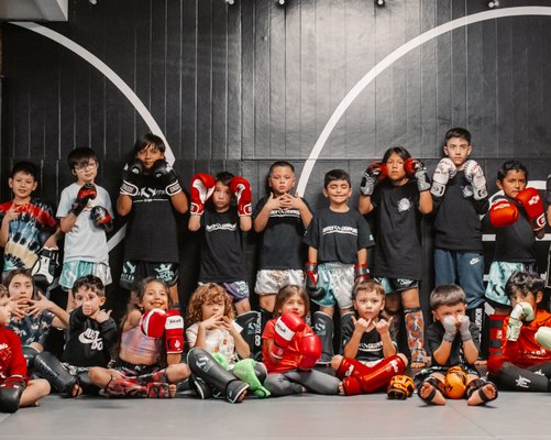 Kid's Muay Thai Class - Our youth programs are designed to help kids stay active, have fun, and learn valuable skills that will benefit them for a lifetime. Your little ones will love our engaging and age appropriate classes, and you’ll love the peace of mind that comes with knowing they’re getting the exercise they need. Kid's Muay Thai Class - Our youth programs are designed to help kids stay active, have fun, and learn valuable skills that will benefit them for a lifetime. Your little ones will love our engaging and age appropriate classes, and you’ll love the peace of mind that comes with knowing they’re getting the exercise they need.