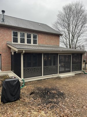 Custom screened in porch with chippendale handrailing ￼ - Designed and built a new backyard screened in porch with custom chippendale style handrailing, French door, ceiling fans and outlets, and kitchen floor